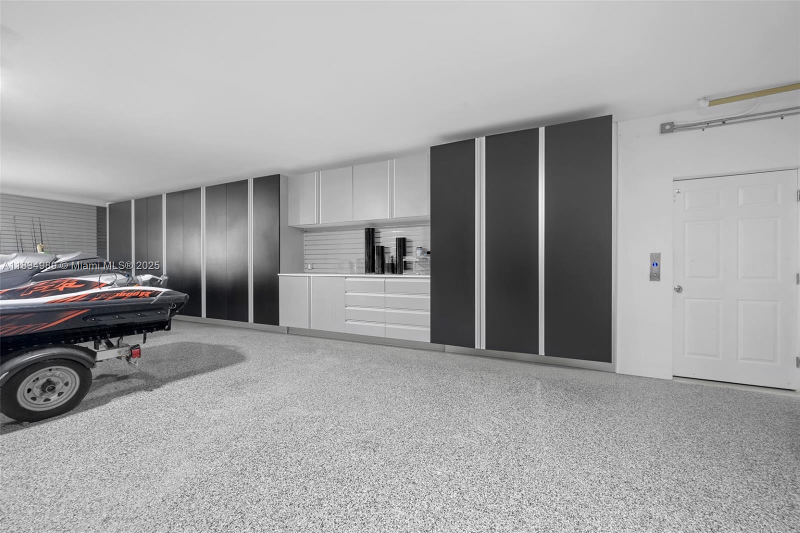 11350 Northwest 8th Street Plantation, FL 33325 - Photo 47 of 68 a car parked in front of garage