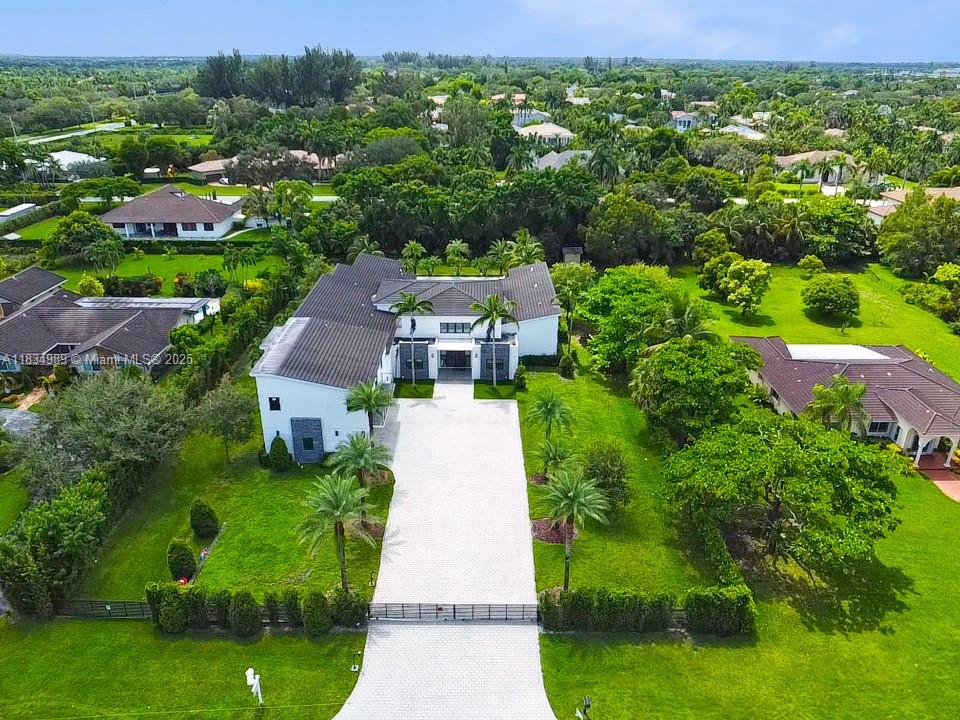 11350 Northwest 8th Street Plantation, FL 33325 - Photo 64 of 68 an aerial view of residential houses with outdoor space and trees