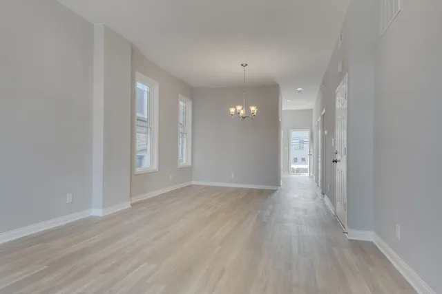 wooden floor with white walls