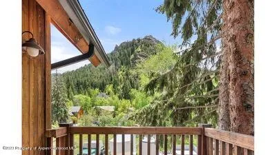 a view of a balcony with a tree
