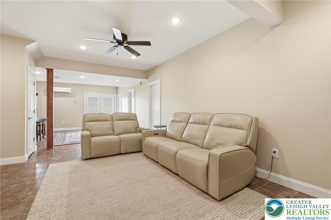 245 East Dell Road Bath, PA 18014 - Photo 56 of 99 A welcoming lower-level space features inviting tile flooring and ample room for relaxation and entertaining.