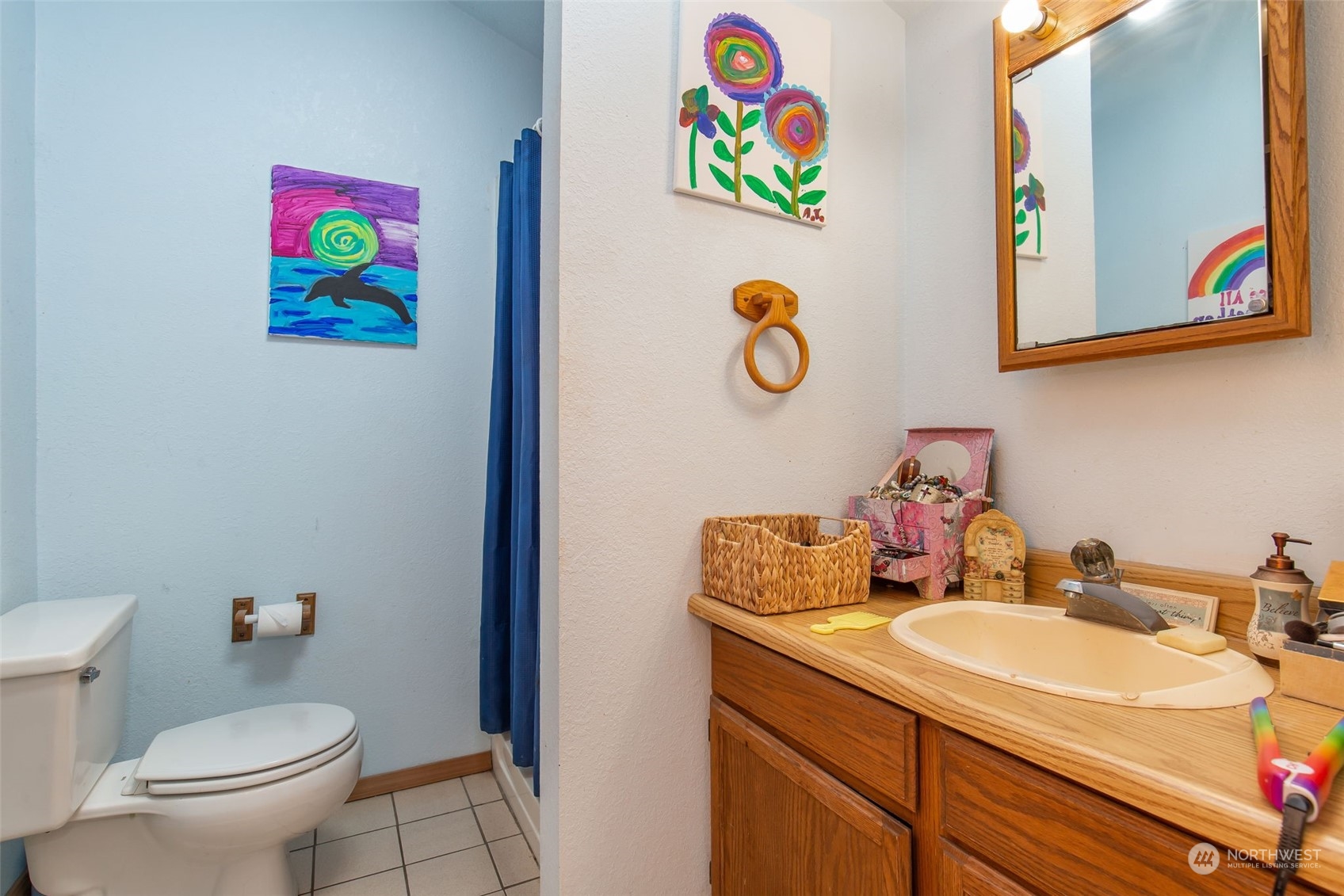 1497 Old Military Road Southeast Tenino, WA 98589 - Photo 15 of 39 a bathroom with a sink mirror and toilet