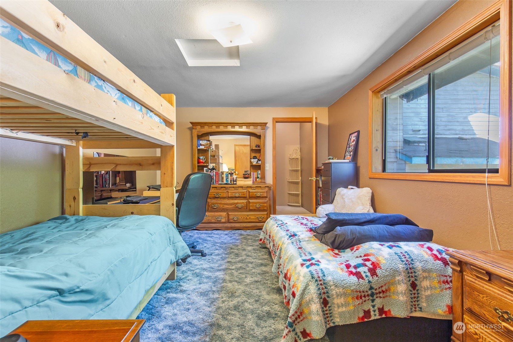 1497 Old Military Road Southeast Tenino, WA 98589 - Photo 17 of 39 a bedroom with furniture and large window