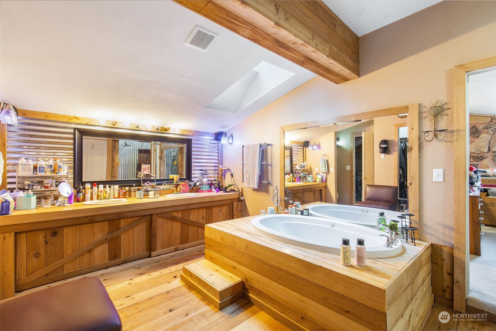 1497 Old Military Road Southeast Tenino, WA 98589 - Photo 18 of 39 a view of a kitchen with kitchen island stainless steel appliances a sink and living room view