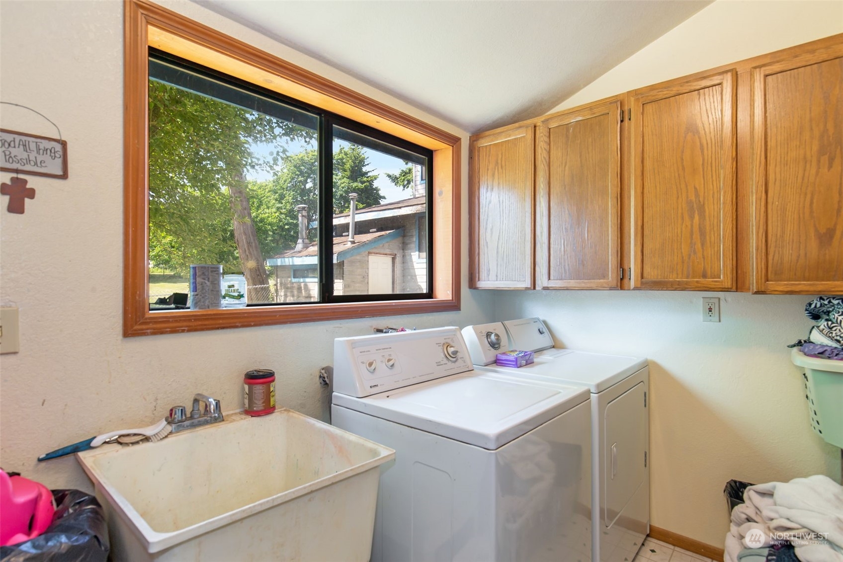 1497 Old Military Road Southeast Tenino, WA 98589 - Photo 9 of 39 a utility room with a window a sink and a cabinets