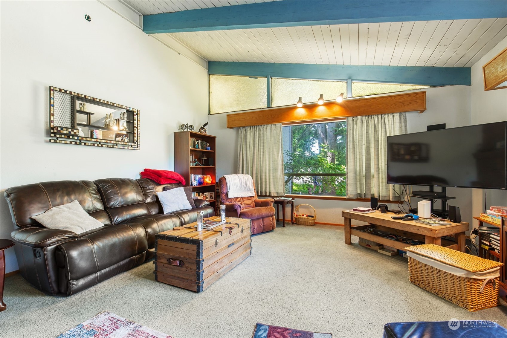 1497 Old Military Road Southeast Tenino, WA 98589 - Photo 10 of 39 a living room with furniture and a flat screen tv