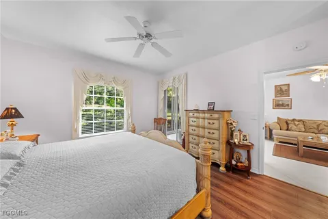 a bed room with a bed and a tv