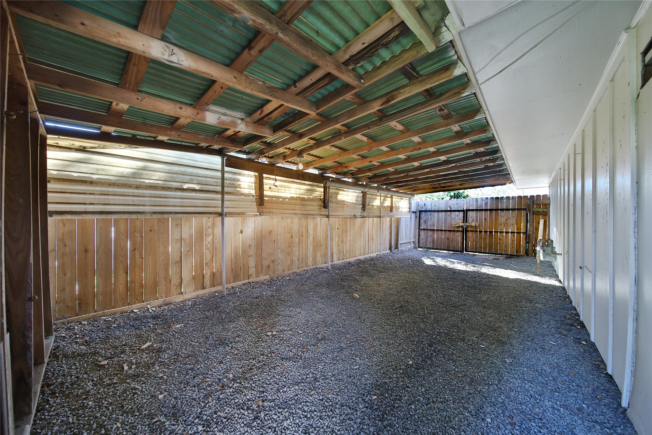 4402 Fallbrook Drive Houston, TX 77018 - Photo 9 of 29 Spacious covered storage space ideal for lawn equipment, hobbies, or additional outdoor organization.