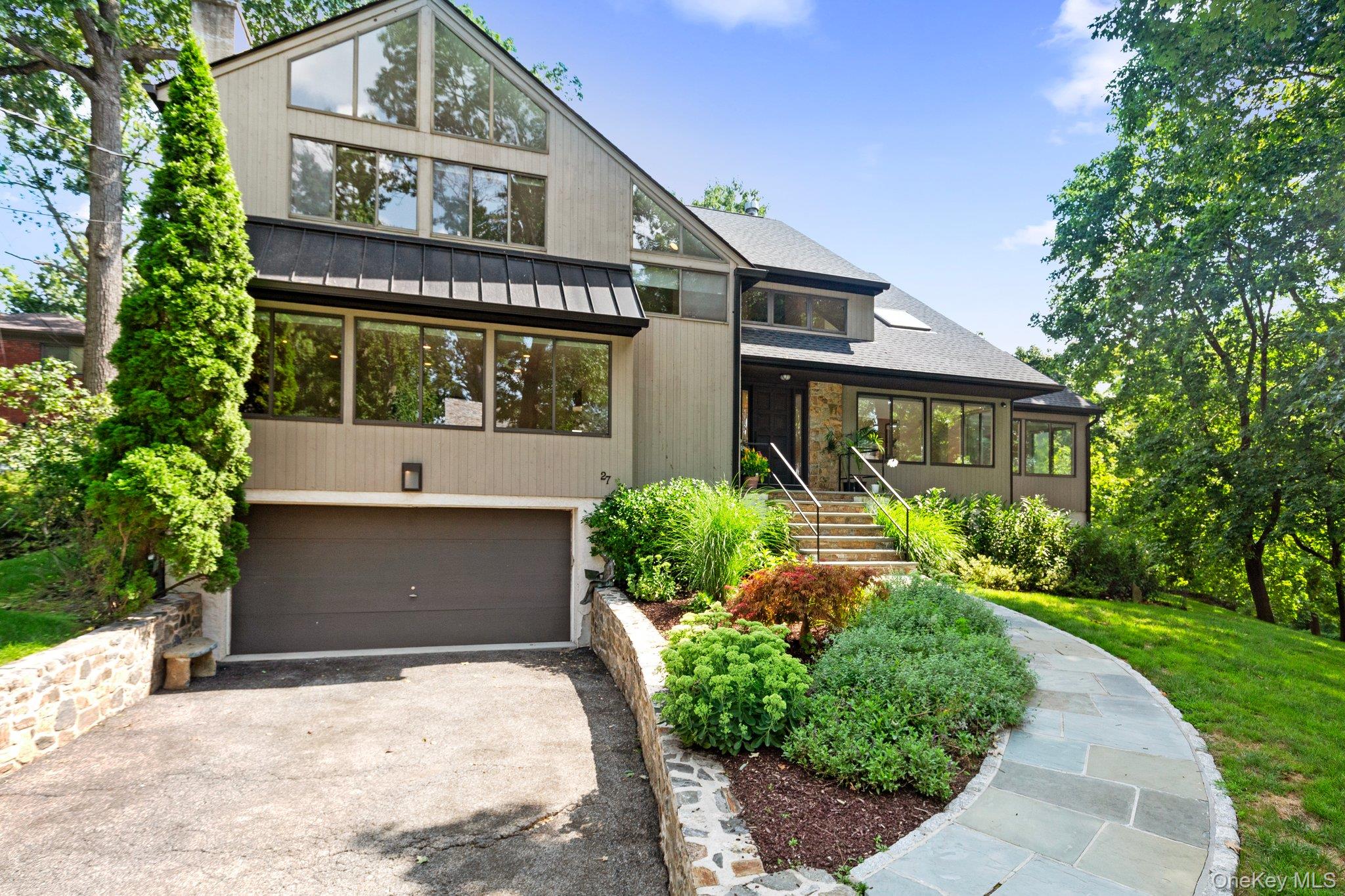 27 Stone Cabin Road New Rochelle, NY 10801 - Photo 2 of 24 Mid-century inspired home featuring driveway and a garage