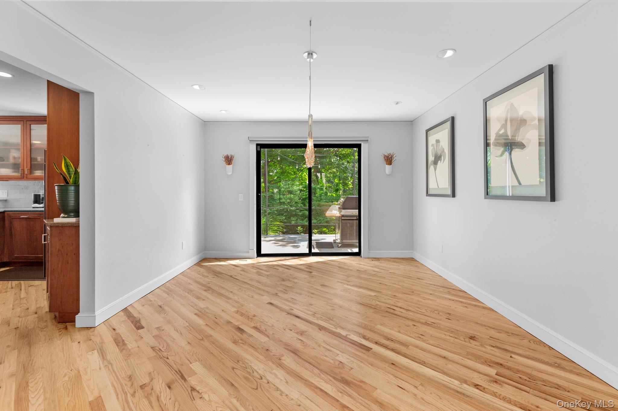 27 Stone Cabin Road New Rochelle, NY 10801 - Photo 10 of 24 Unfurnished dining area featuring light wood finished floors, baseboards, and recessed lighting