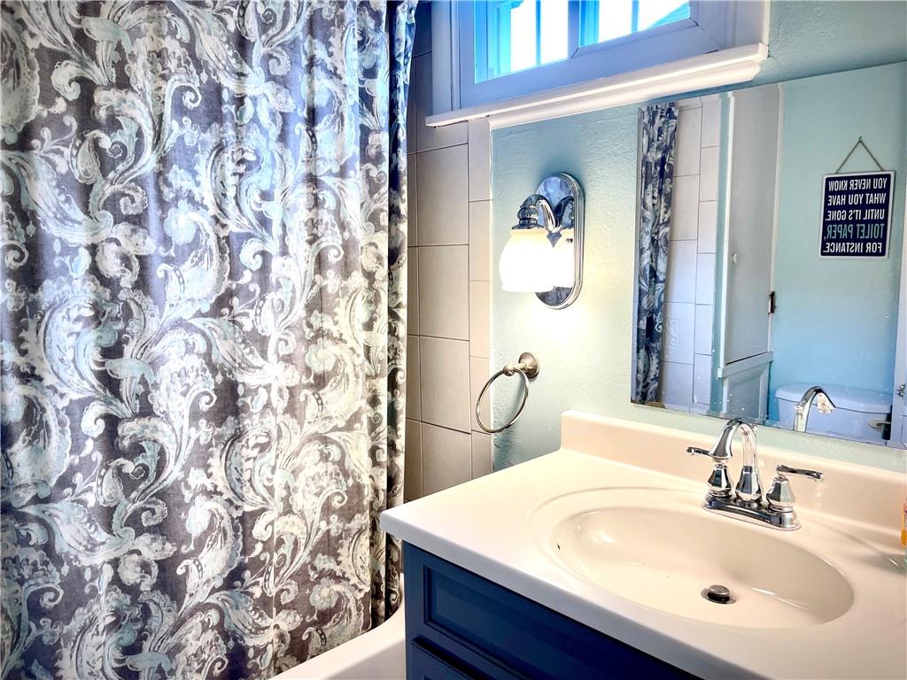 224 West Pearl Street Butler, PA 16001 - Photo 11 of 30 a bathroom with a sink and a mirror