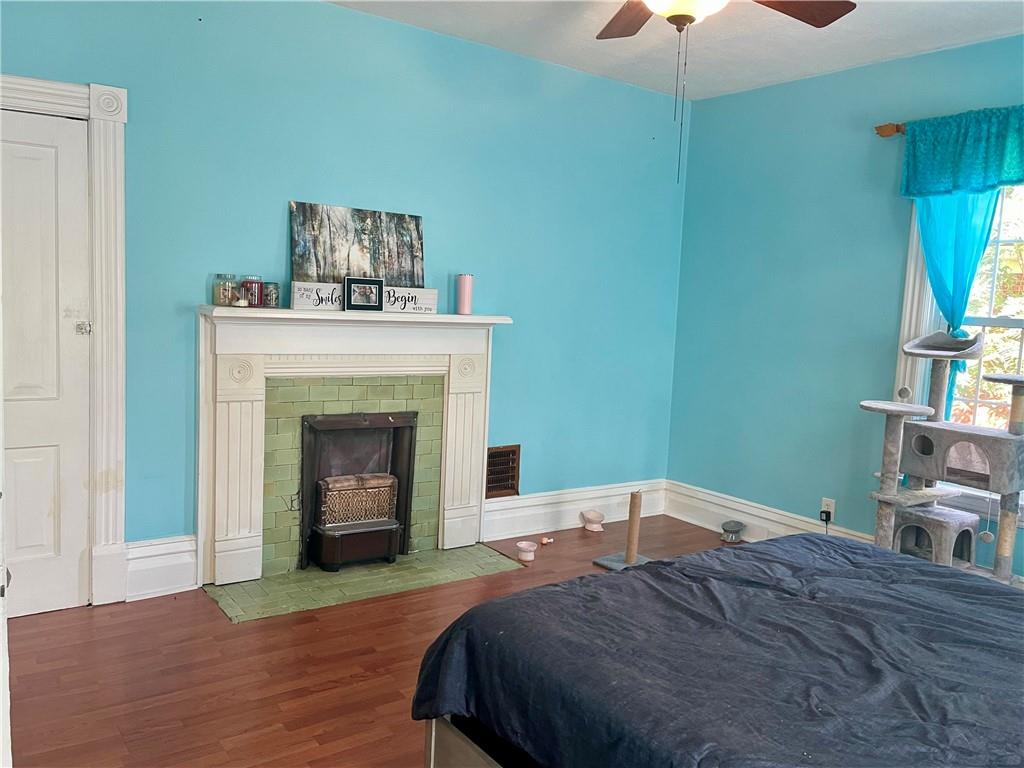 224 West Pearl Street Butler, PA 16001 - Photo 15 of 30 a bedroom with a bed and a fireplace