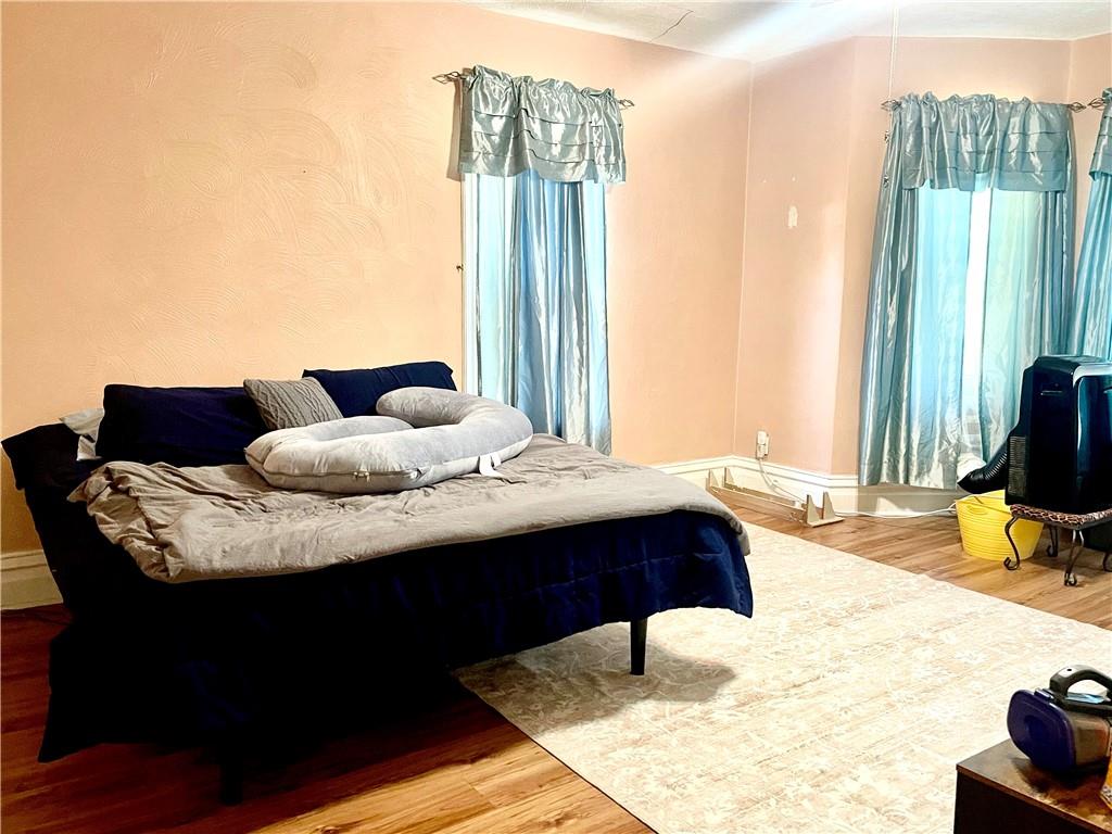 224 West Pearl Street Butler, PA 16001 - Photo 16 of 30 a bedroom with a bed and wooden floor