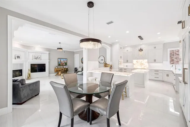 a bathroom with a sink a mirror and a bathtub next to a window