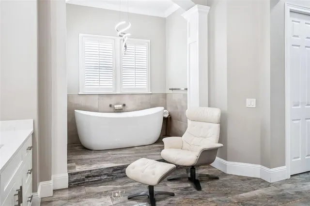 a bathroom with a glass shower door and a sink