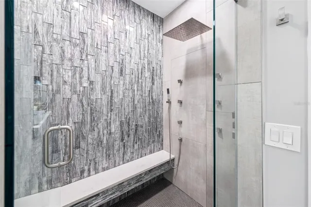 a white tub sitting next to a window