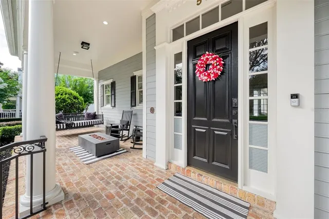 a view of a chairs and table in the balcony