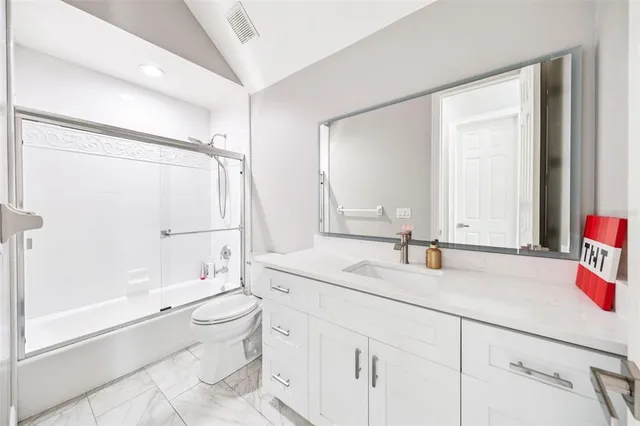 a view of a storage and utility room with washer and dryer