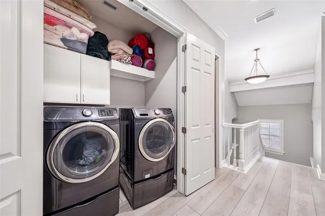 a bedroom with a bed and a book shelf