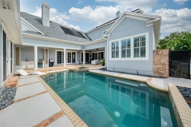 front view of a house with a swimming pool