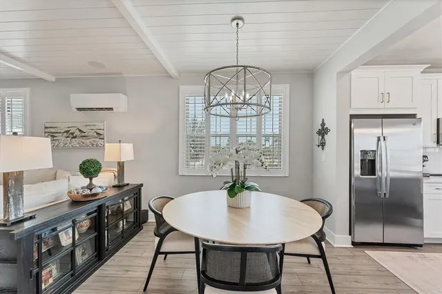 a large kitchen with lots of counter space a sink appliances and cabinets