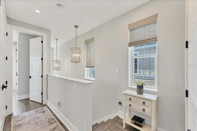 a balcony with furniture and a potted plant