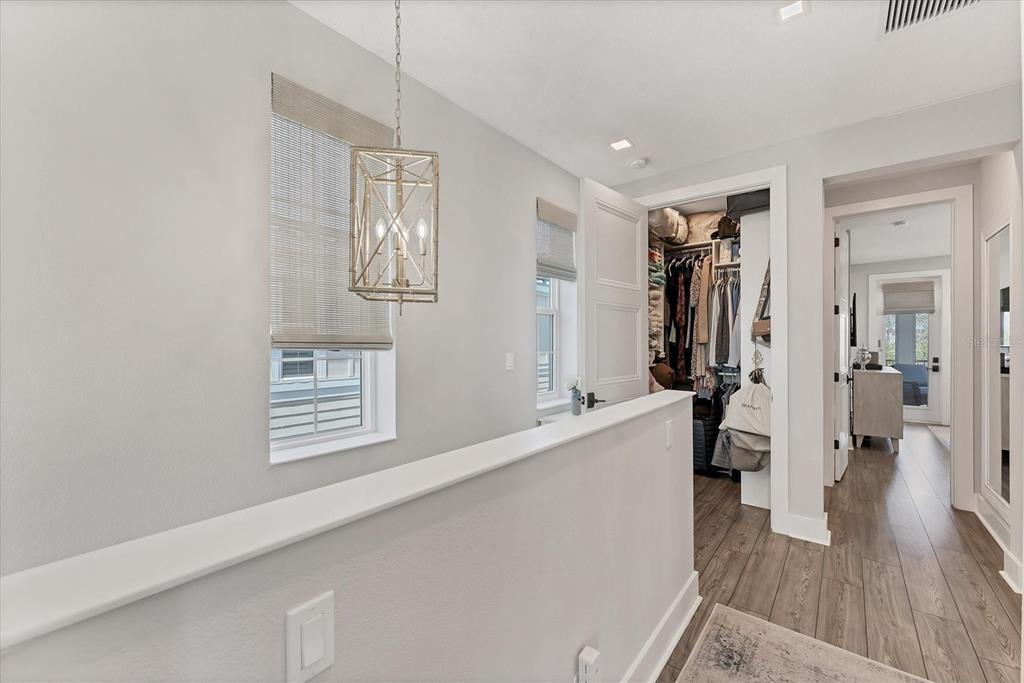 4357 Marina Vw Way Cortez, FL 34215 - Photo 30 of 59 a living room with stainless steel appliances furniture a refrigerator and a wooden floor