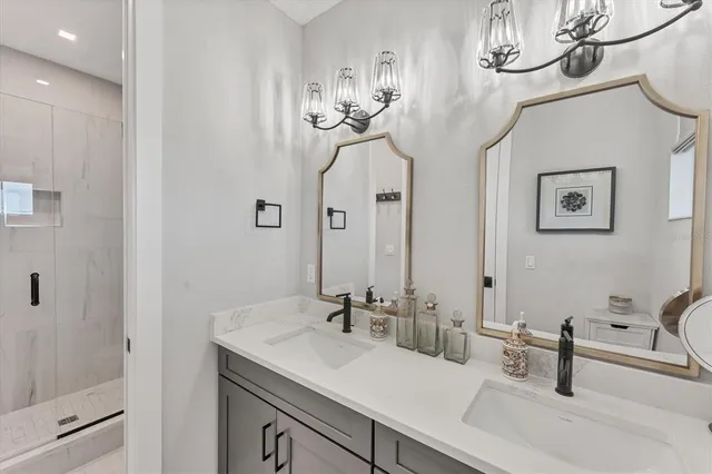 a bathroom with a sink mirror and toilet