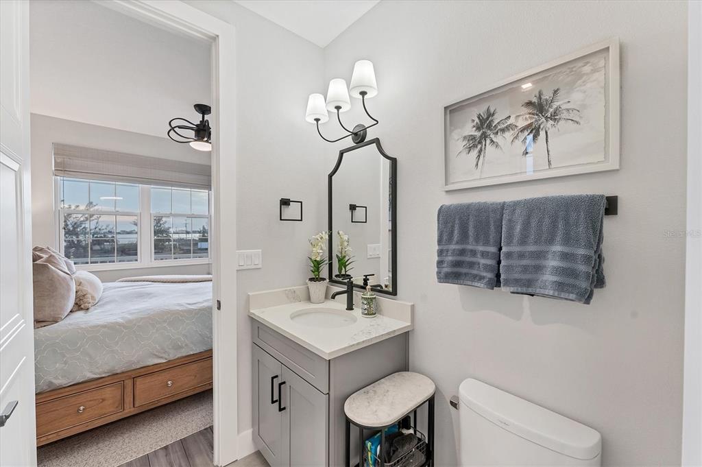 4357 Marina Vw Way Cortez, FL 34215 - Photo 42 of 59 a bathroom with a sink mirror and toilet