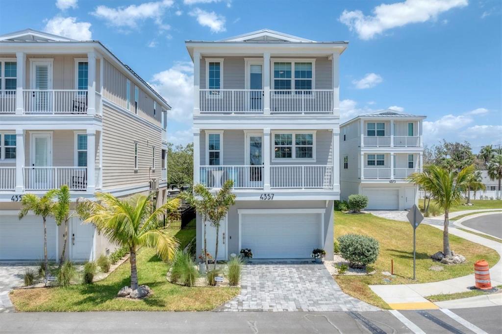 4357 Marina Vw Way Cortez, FL 34215 - Photo 48 of 59 a front view of a house with a garden