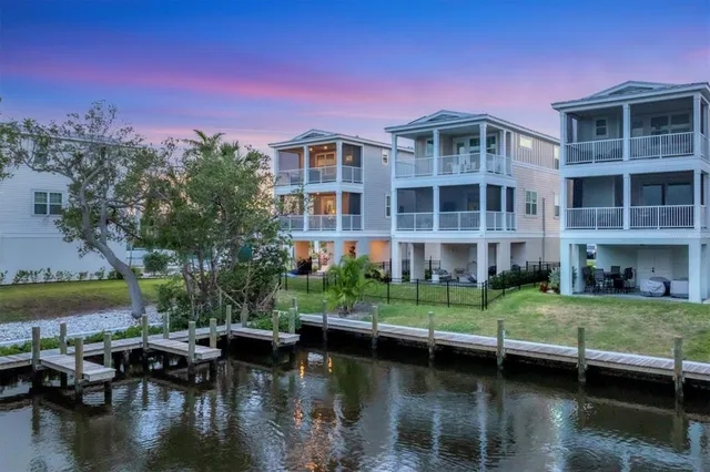 a lake view with a seating space and fir pit
