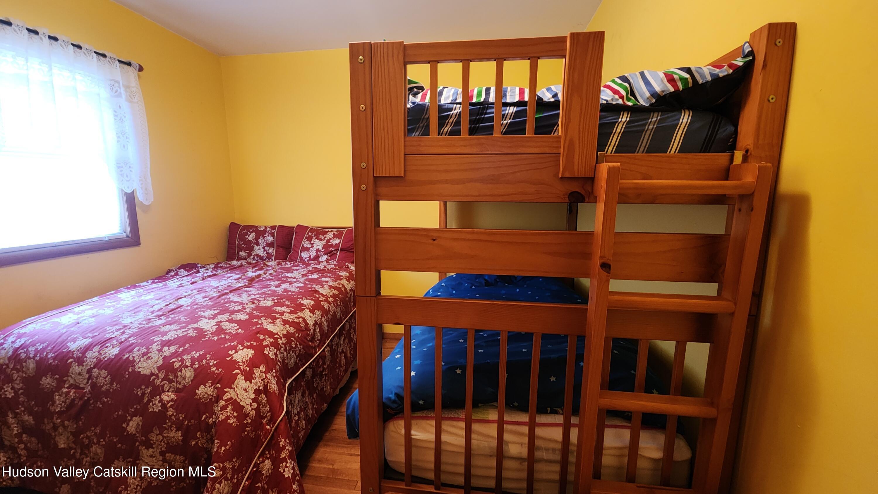 17 Clay Hill Road Durham, NY 12423 - Photo 11 of 15 a bedroom with a bed and a window