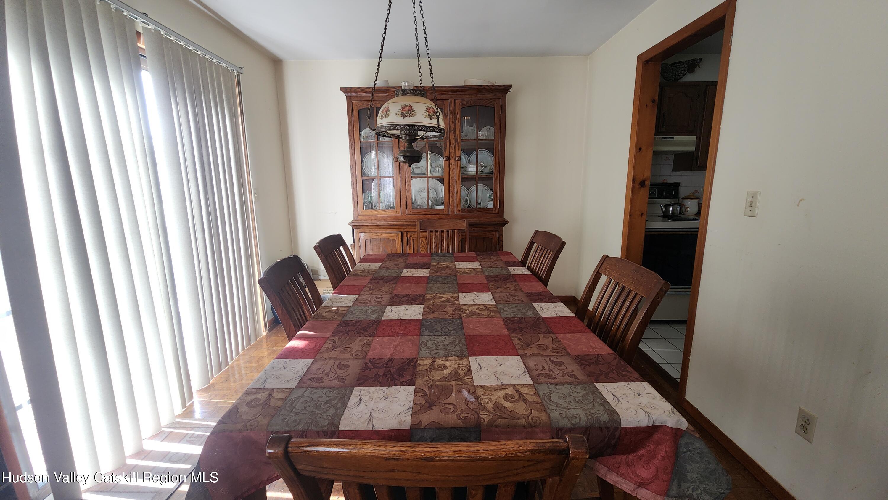 17 Clay Hill Road Durham, NY 12423 - Photo 4 of 15 a view of a dining room with furniture and window