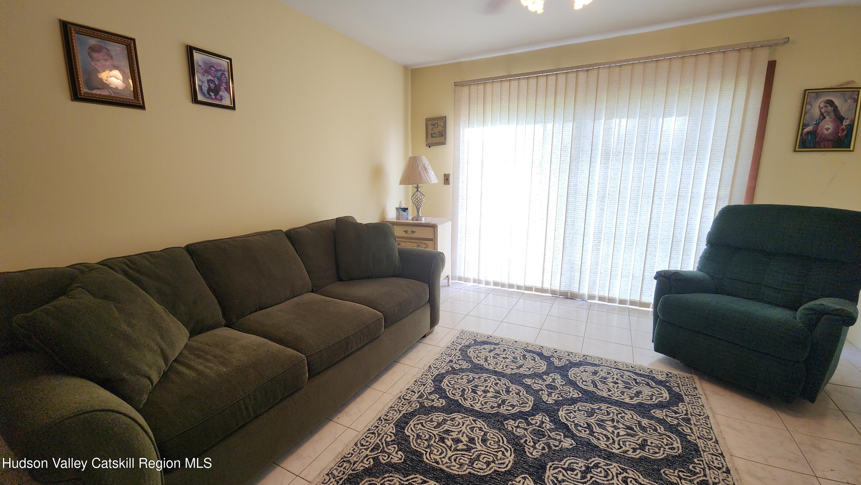 17 Clay Hill Road Durham, NY 12423 - Photo 6 of 15 a living room with furniture and a window