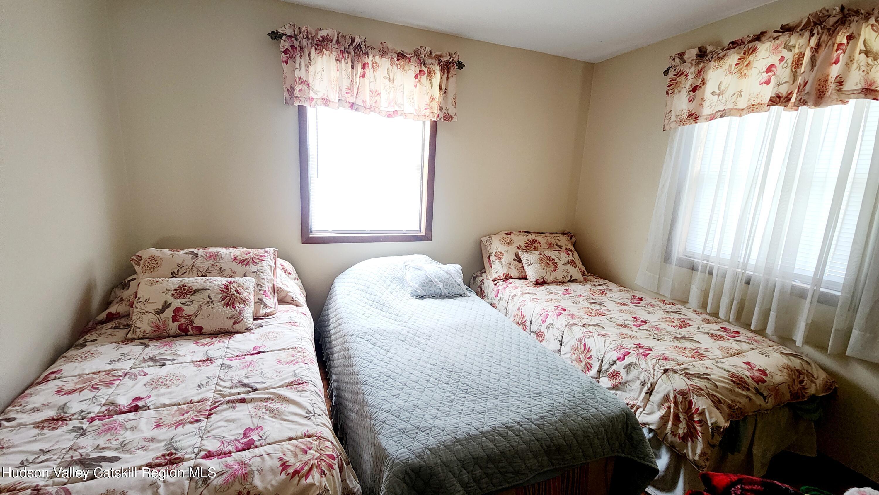 17 Clay Hill Road Durham, NY 12423 - Photo 9 of 15 a bedroom with a bed and a window