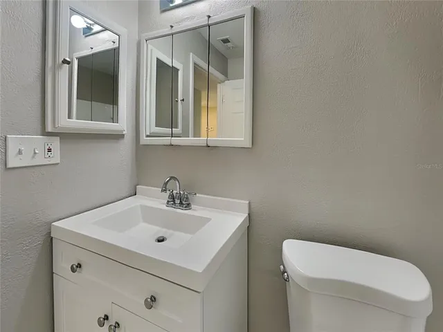 a view of a porch with wooden floor and city view