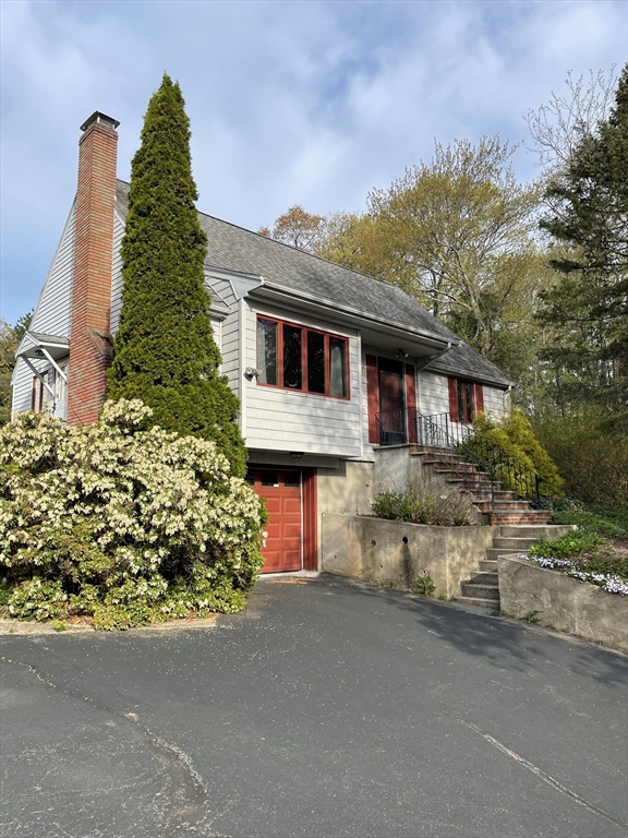 100 Francis Wyman Road Burlington, MA 01803 - Photo 1 of 17 front view of a house with a street