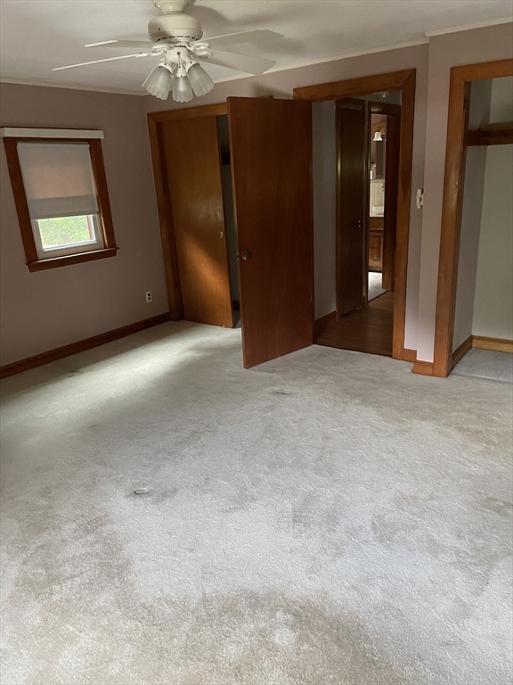 100 Francis Wyman Road Burlington, MA 01803 - Photo 9 of 17 an empty room with chandelier fan and door