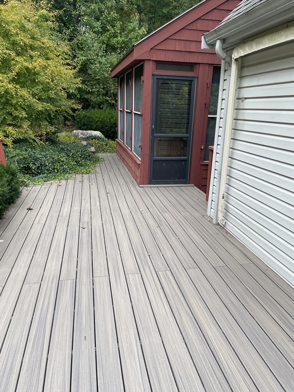 100 Francis Wyman Road Burlington, MA 01803 - Photo 10 of 17 a view of backyard with wooden deck and floor to ceiling window