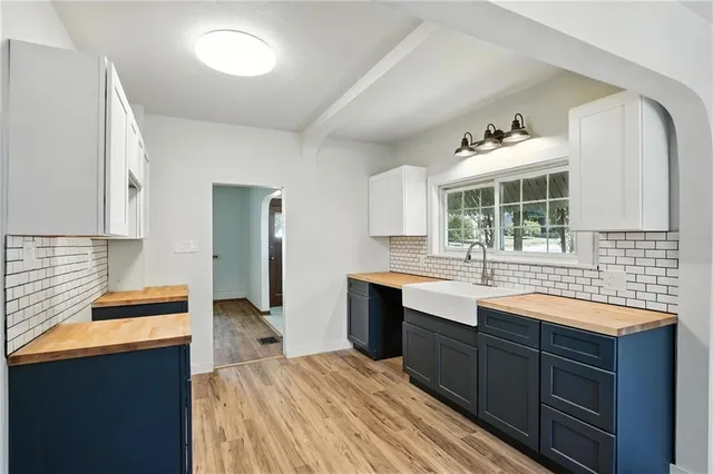 a kitchen with a sink and cabinets