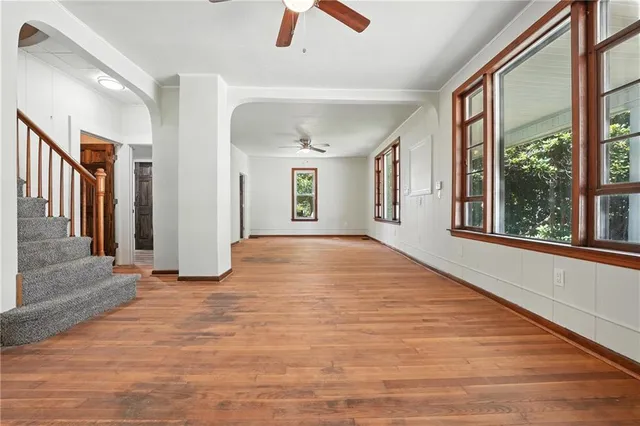 a view of an entryway with wooden floor