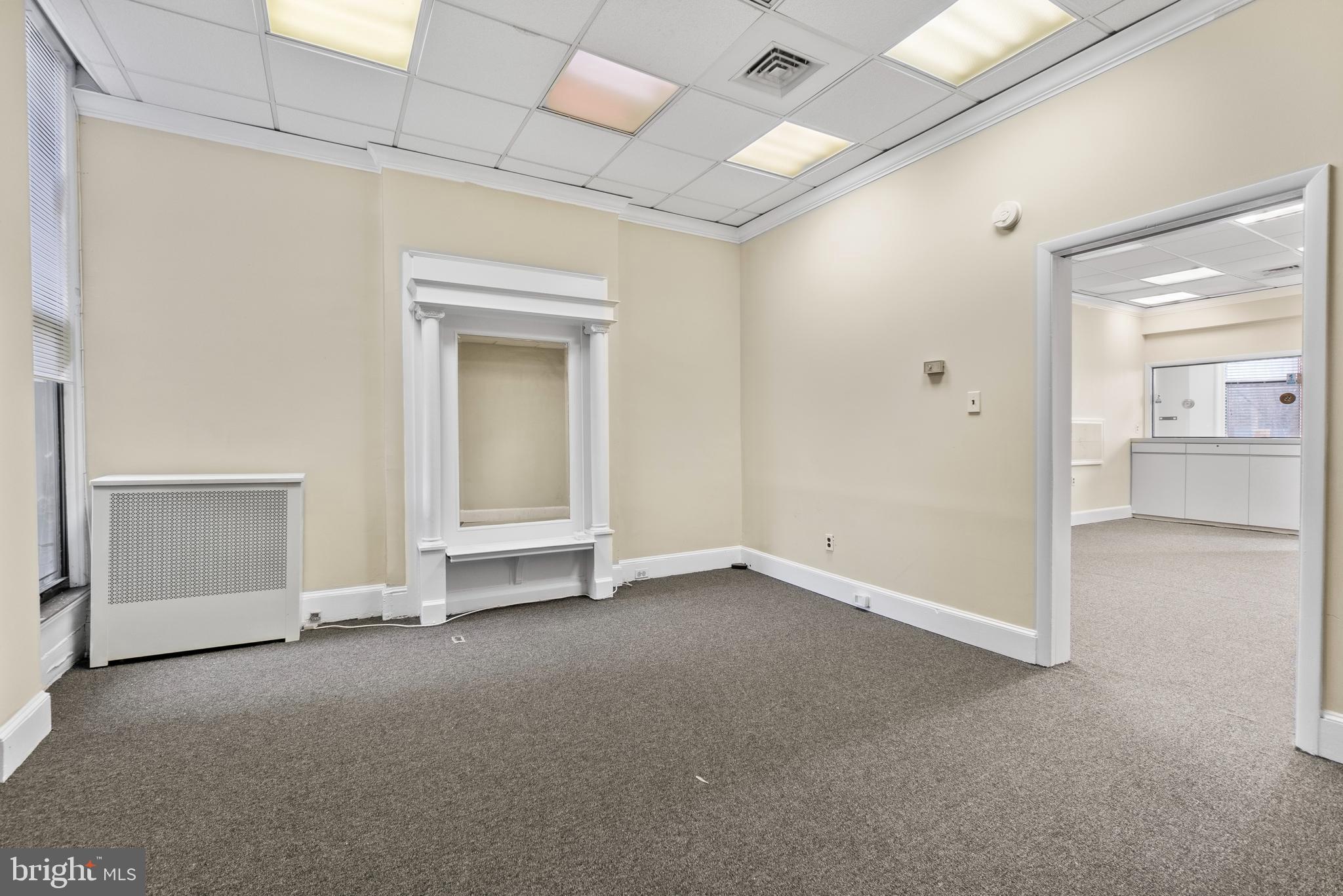 28 East 25th Street Baltimore, MD 21218 - Photo 6 of 41 an empty room with a empty space and windows