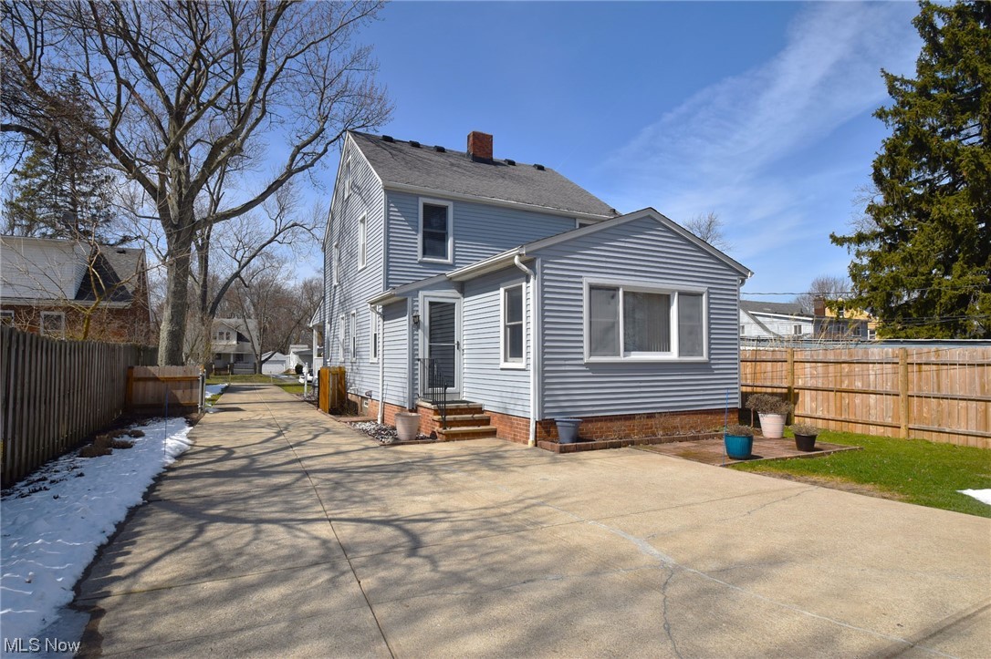 1521 Sheffield Road Cleveland, OH 44121 - Photo 25 of 29 View of addition from the back and concrete driveway.