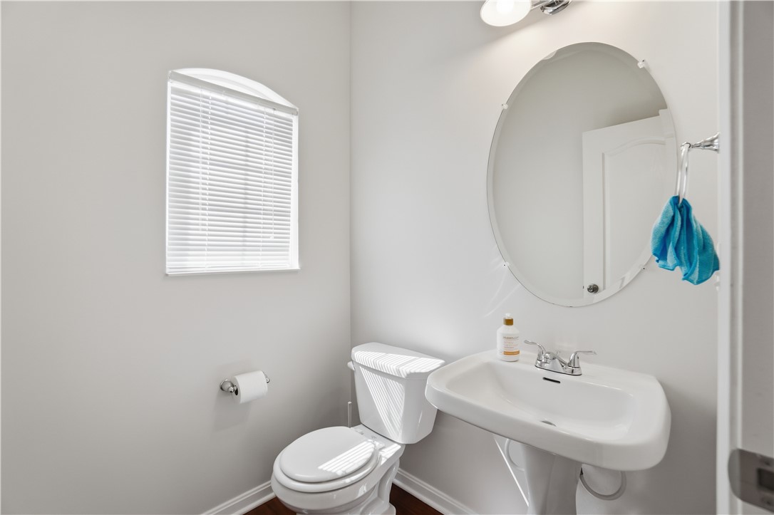 4294 Straight Arrow Road Dayton, OH 45430 - Photo 16 of 41 This bright bathroom features a pedestal sink and window with natural light.