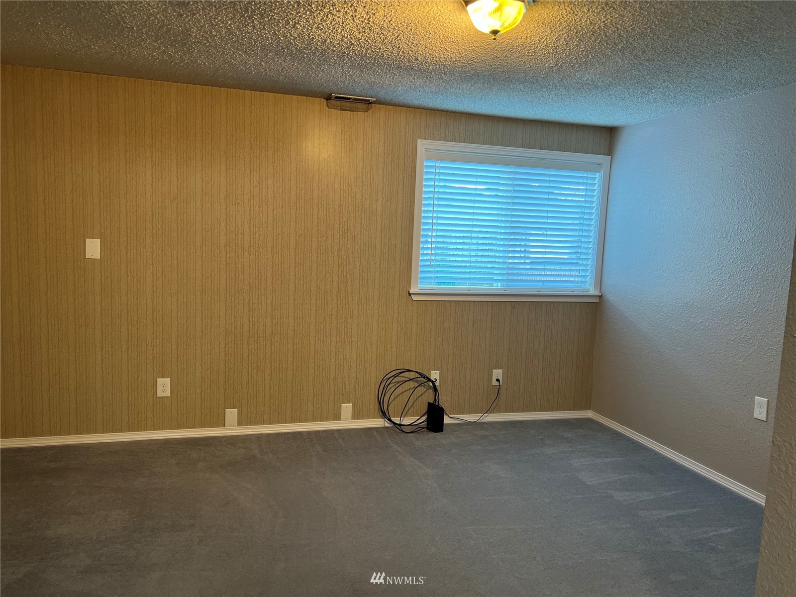 7407 Vandermark Road East Bonney Lake, WA 98391 - Photo 11 of 30 an empty room with a window