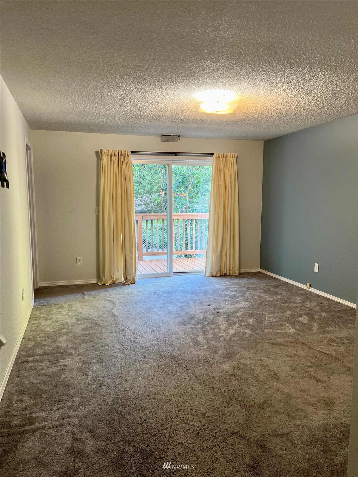 7407 Vandermark Road East Bonney Lake, WA 98391 - Photo 12 of 30 an empty room with windows