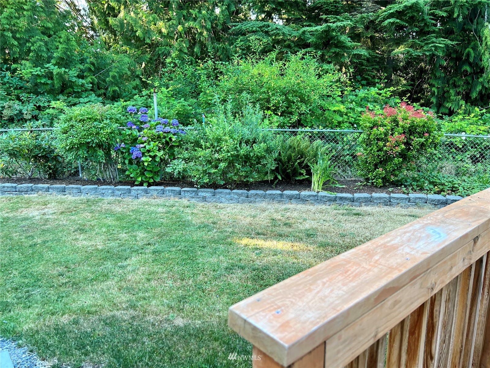 7407 Vandermark Road East Bonney Lake, WA 98391 - Photo 17 of 30 a view of a backyard with a garden and plants