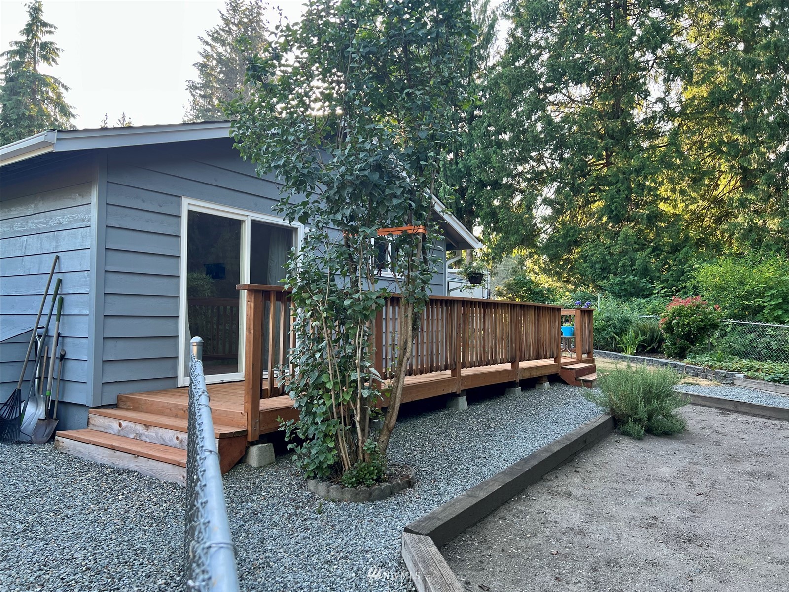 7407 Vandermark Road East Bonney Lake, WA 98391 - Photo 21 of 30 a backyard of a house with lots of green space