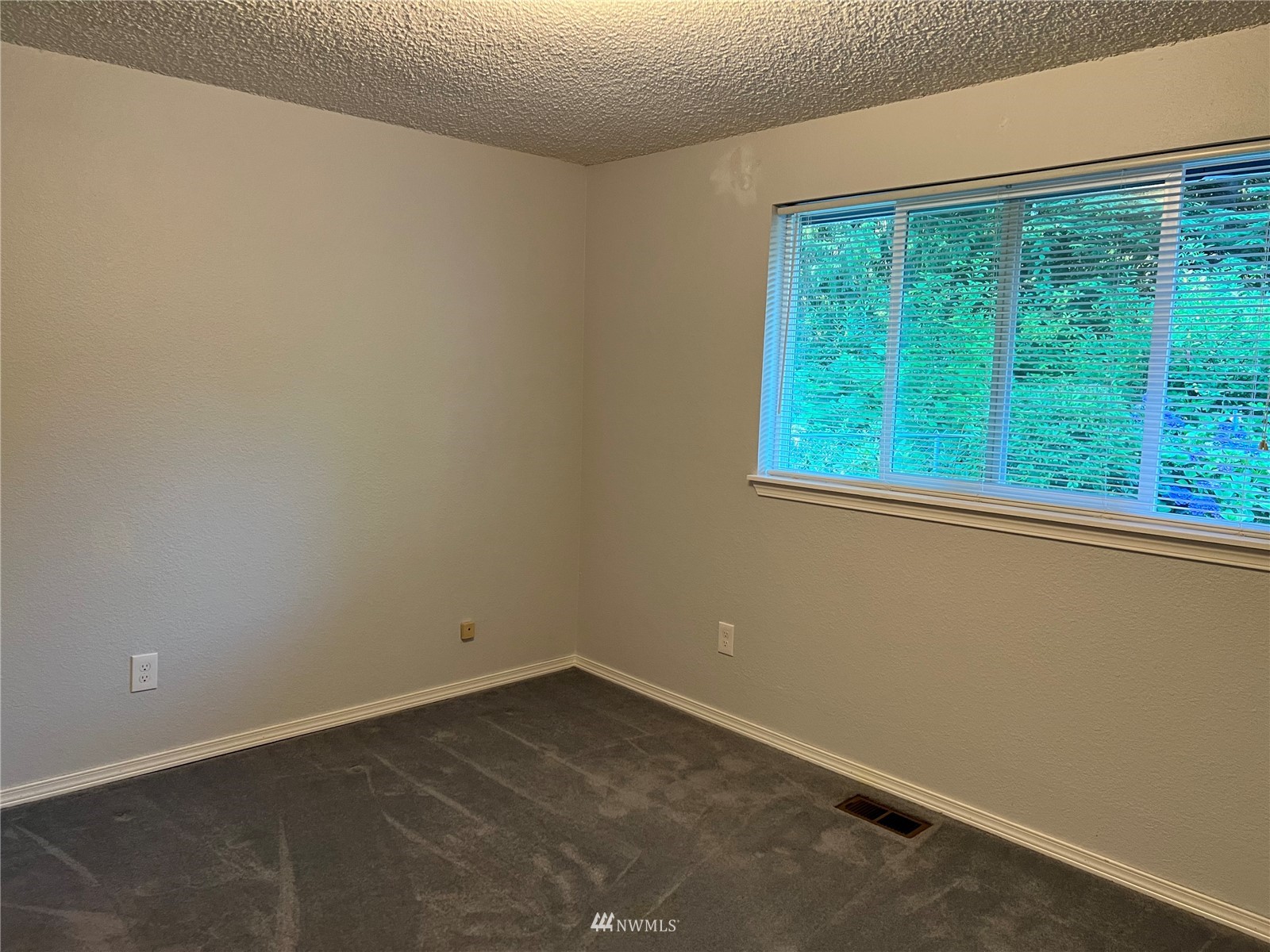 7407 Vandermark Road East Bonney Lake, WA 98391 - Photo 6 of 30 an empty room with a window