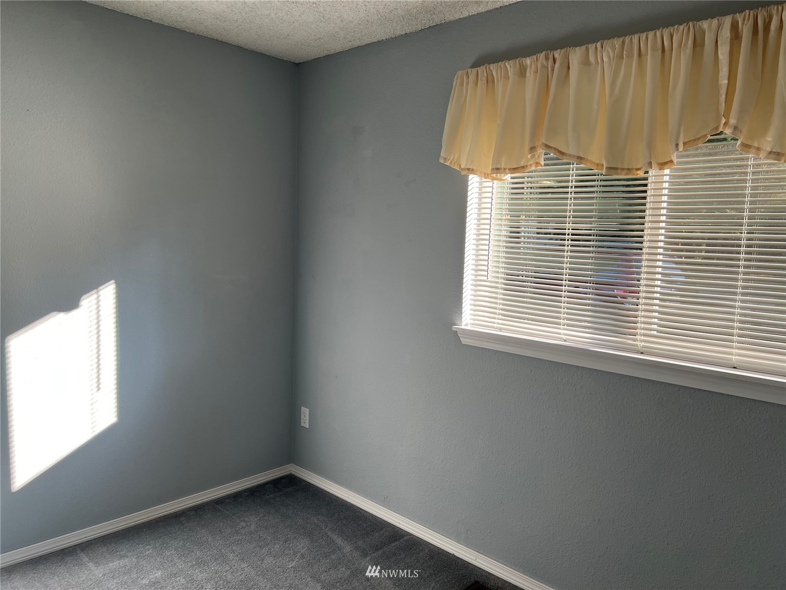 7407 Vandermark Road East Bonney Lake, WA 98391 - Photo 8 of 30 an empty room with a window
